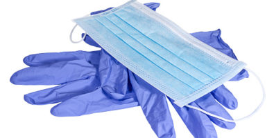 Blue medical mask on the latex gloves on white background. Medical and healthcare. Conception of hygiene, protective and care.